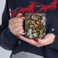 A ceramic mug with a floral pattern inspired by William Morris & Co - Golden Lily Collection in a midnight colour palette.