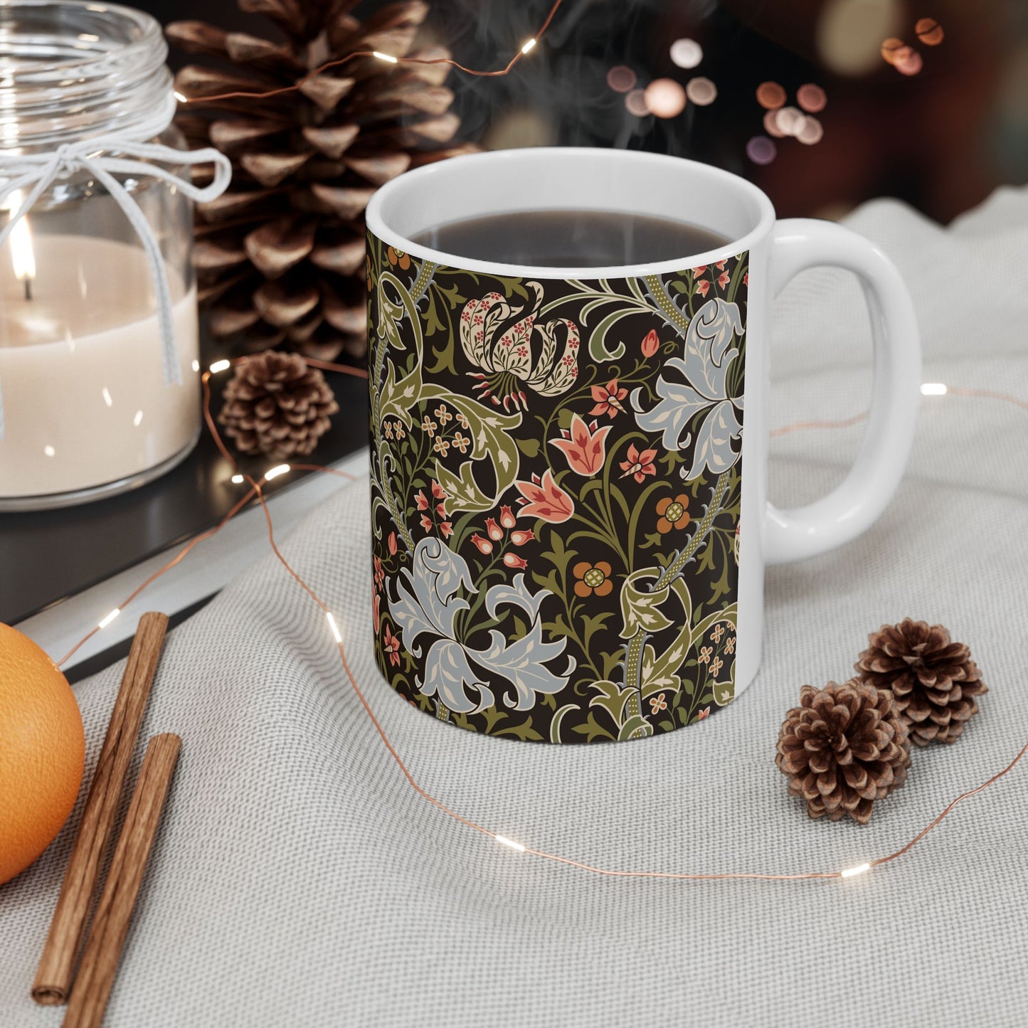A ceramic mug with a floral pattern inspired by William Morris & Co - Golden Lily Collection in a midnight colour palette.