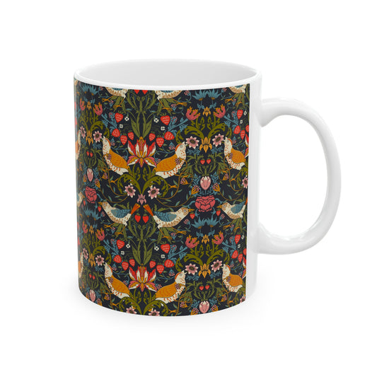 A ceramic mug with a colorful floral pattern and birds, inspired by William Morris' Strawberry Thief collection.