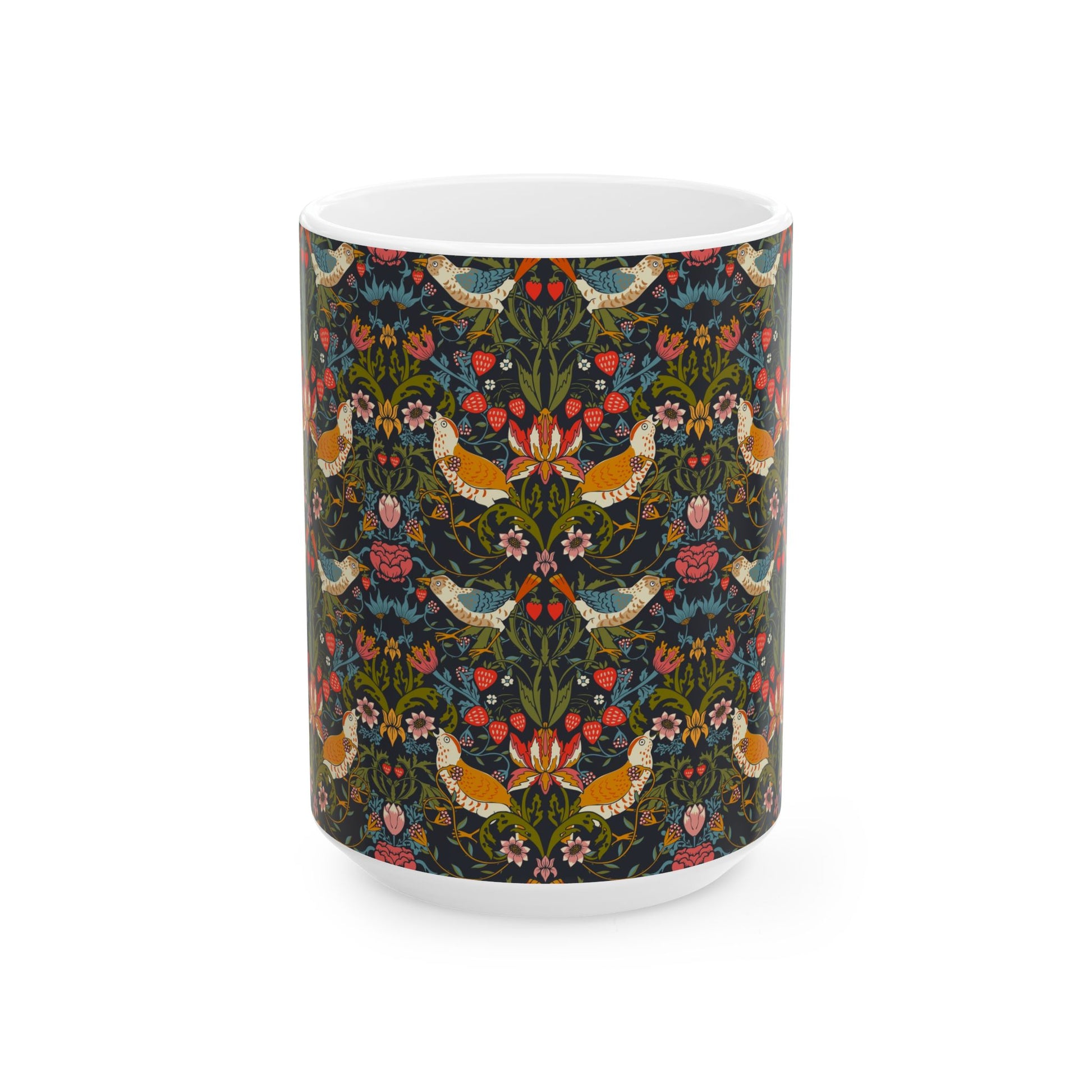 A ceramic mug with a colorful floral pattern and birds, inspired by William Morris' Strawberry Thief collection.