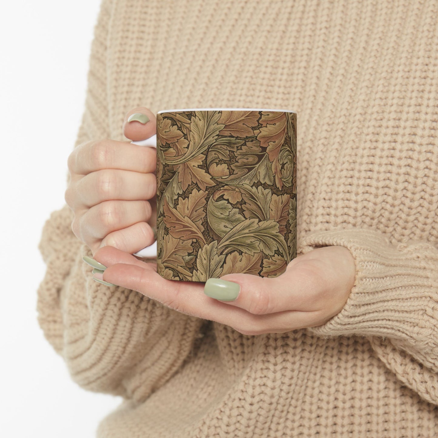 A ceramic mug with a brown and white geometric pattern inspired by William Morris - Acanthus Collection.