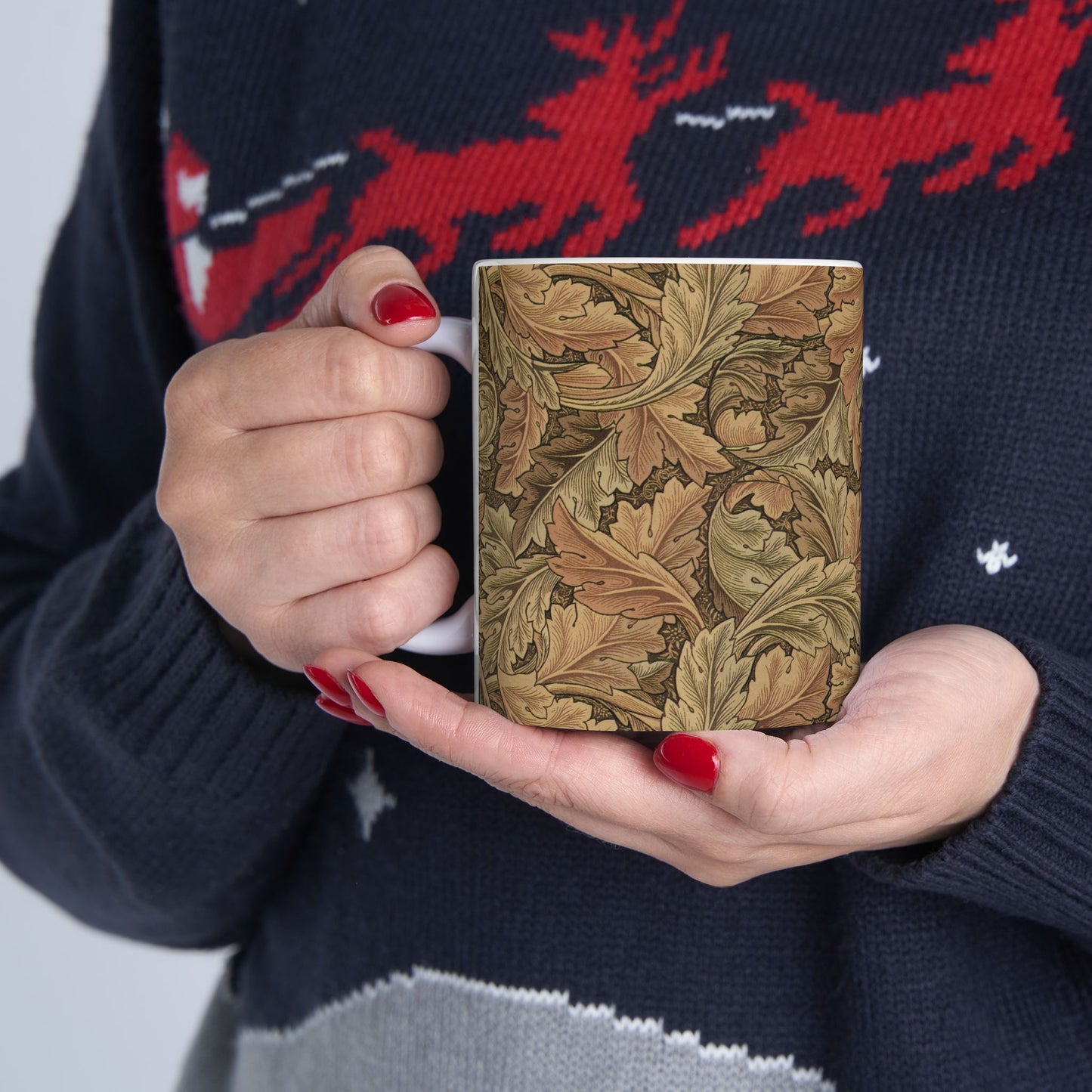 A ceramic mug with a brown and white geometric pattern inspired by William Morris - Acanthus Collection.
