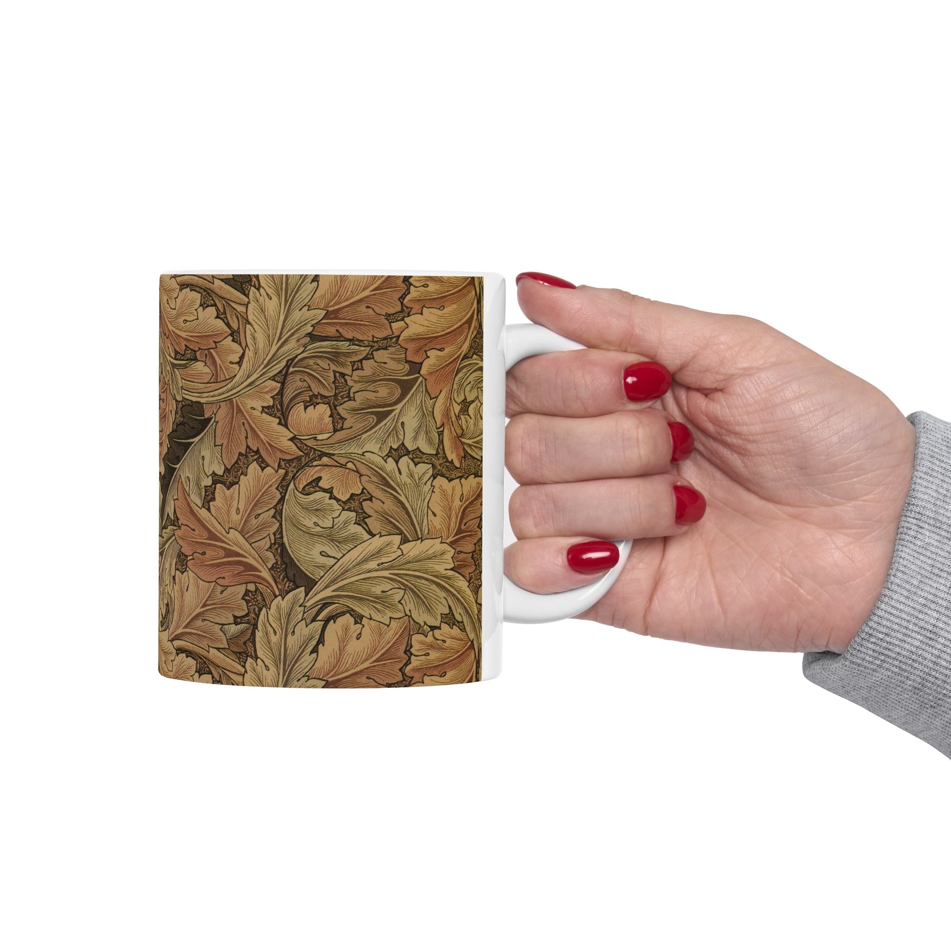 A ceramic mug with a brown and white geometric pattern inspired by William Morris - Acanthus Collection.