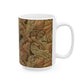 A ceramic mug with a brown and white geometric pattern inspired by William Morris - Acanthus Collection.