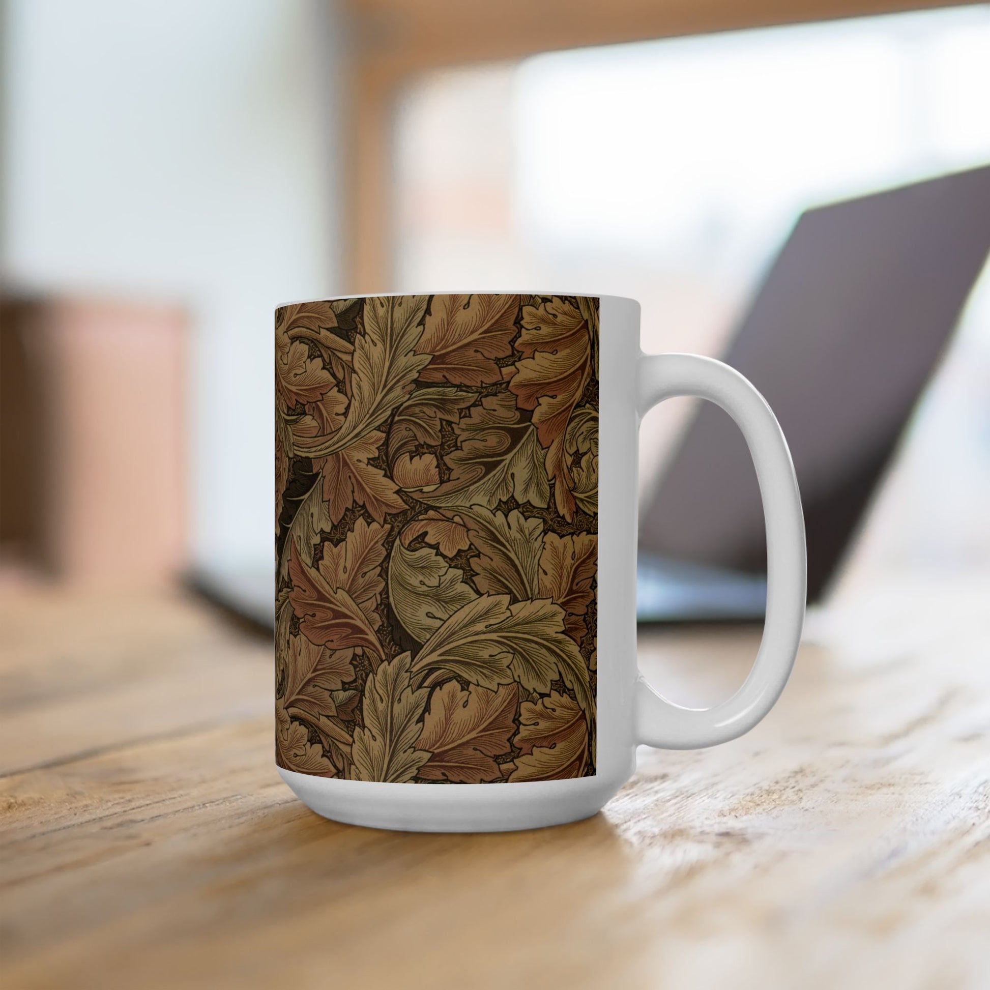 A ceramic mug with a brown and white geometric pattern inspired by William Morris - Acanthus Collection.