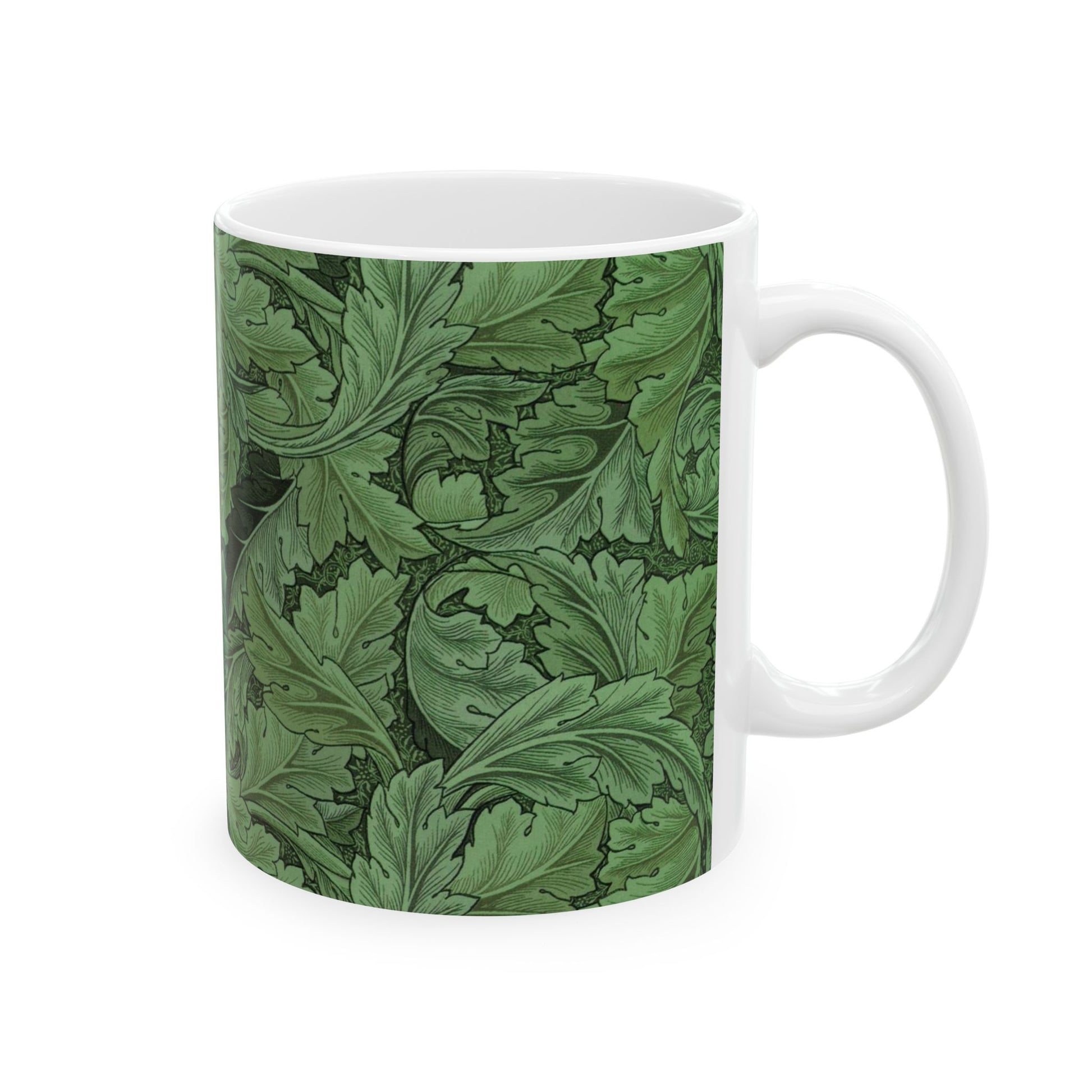 A ceramic mug with a green and white leaf pattern inspired by William Morris - Acanthus Collection.