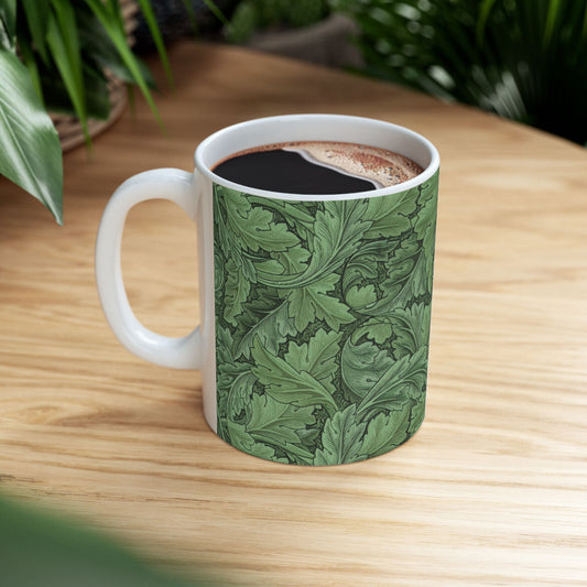 A ceramic mug with a green and white leaf pattern inspired by William Morris - Acanthus Collection.