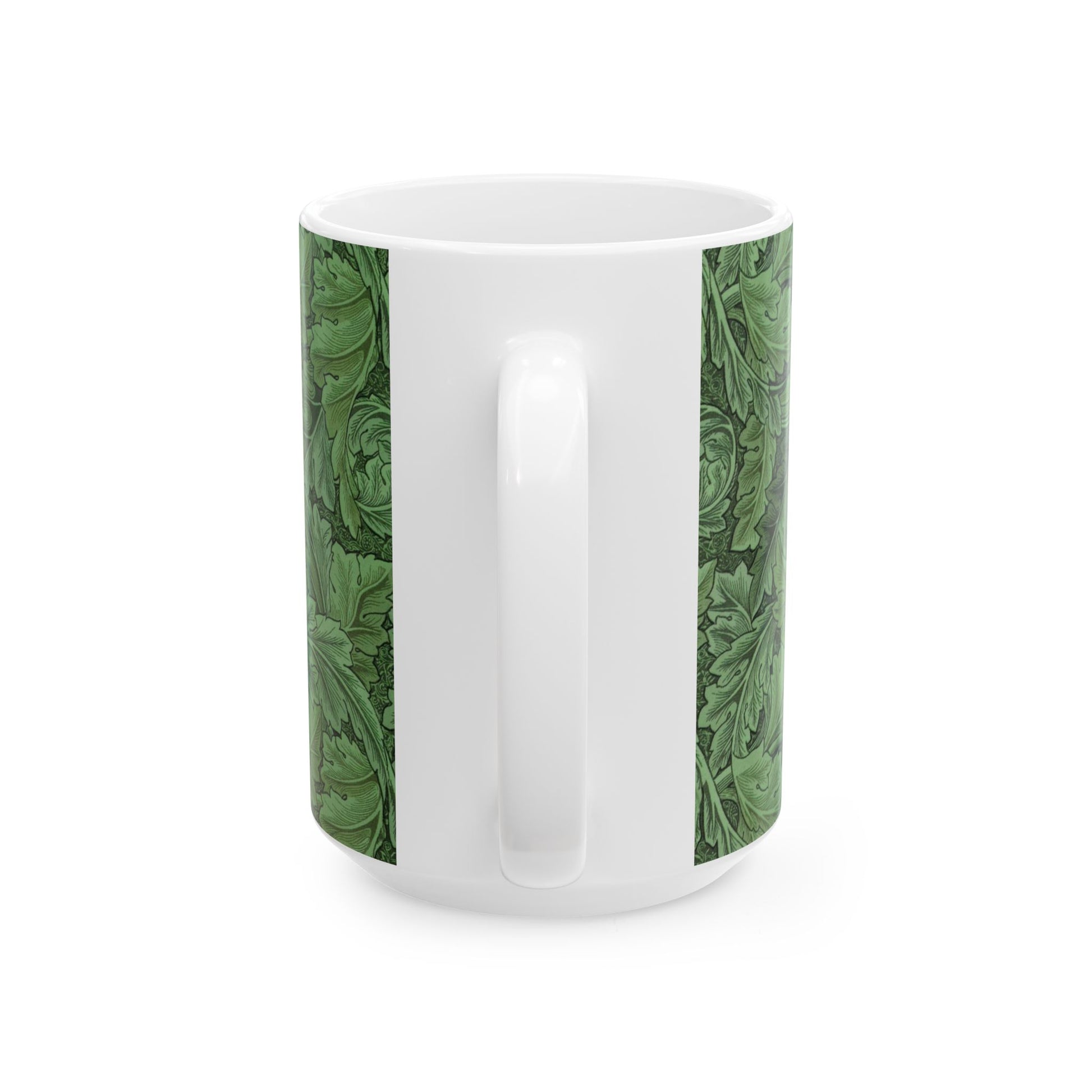 A ceramic mug with a green and white leaf pattern inspired by William Morris - Acanthus Collection.