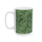 A ceramic mug with a green and white leaf pattern inspired by William Morris - Acanthus Collection.