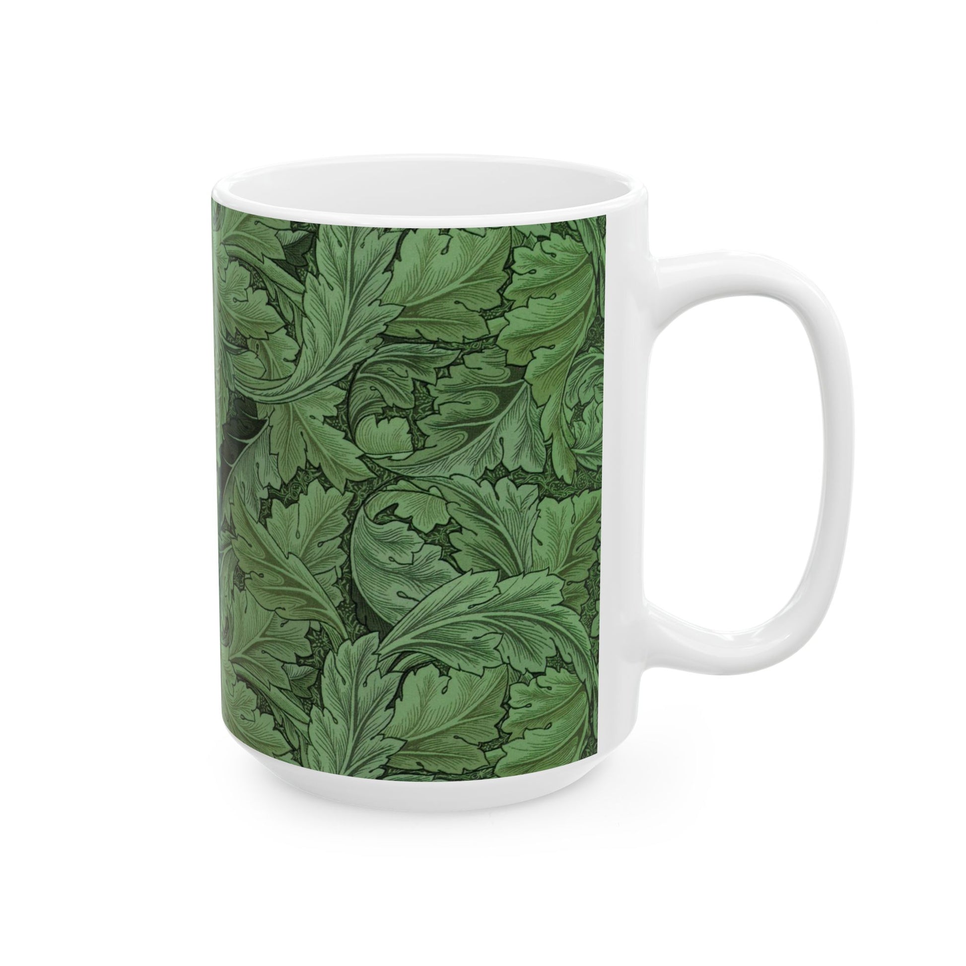 A ceramic mug with a green and white leaf pattern inspired by William Morris - Acanthus Collection.