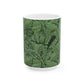 A ceramic mug with a green and white leaf pattern inspired by William Morris - Acanthus Collection.