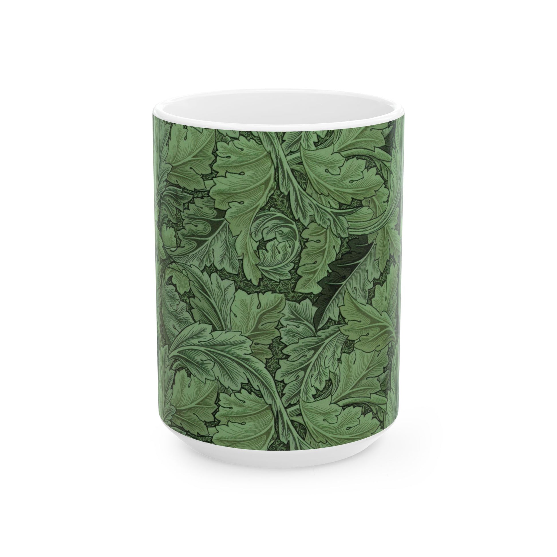 A ceramic mug with a green and white leaf pattern inspired by William Morris - Acanthus Collection.