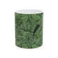 A ceramic mug with a green and white leaf pattern inspired by William Morris - Acanthus Collection.