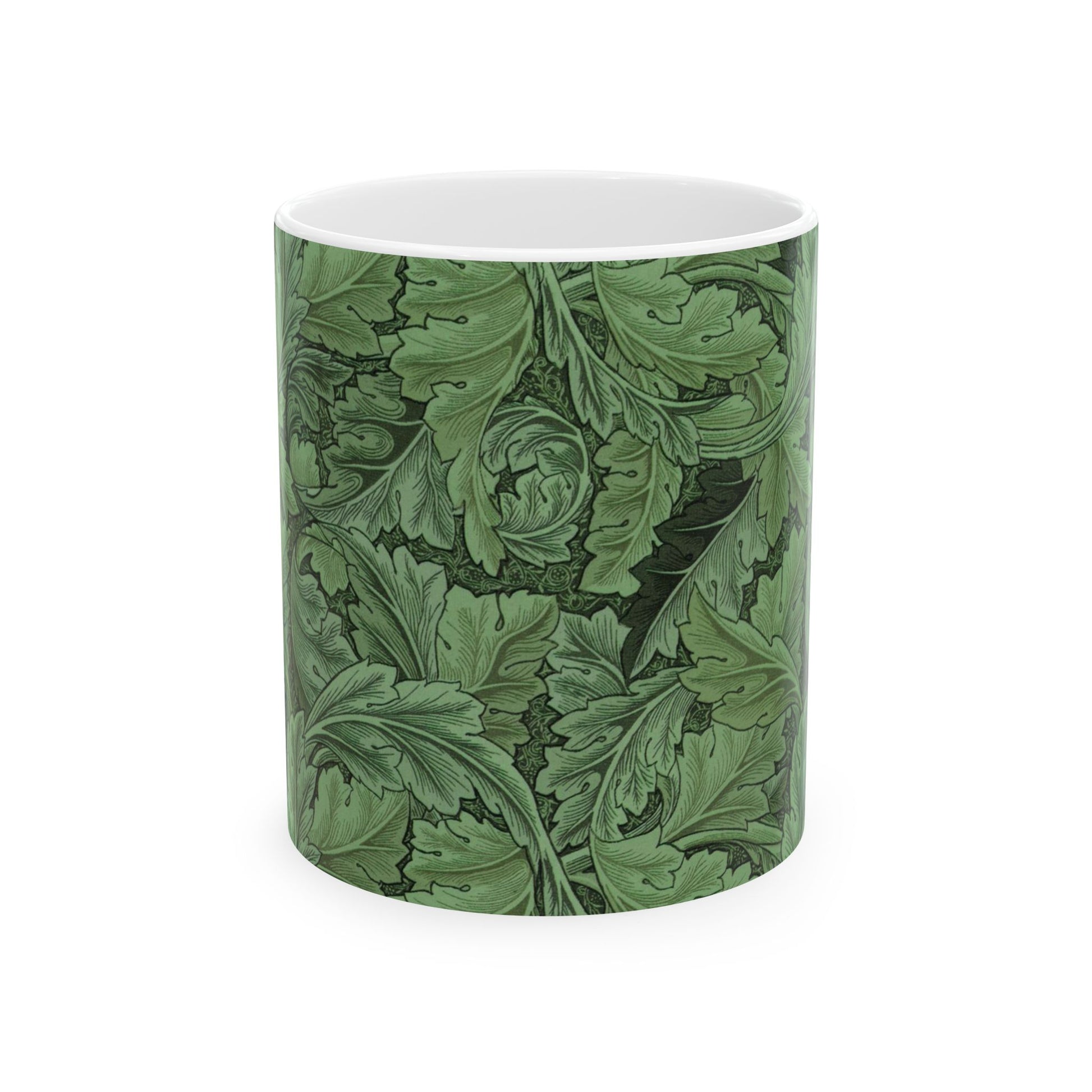 A ceramic mug with a green and white leaf pattern inspired by William Morris - Acanthus Collection.