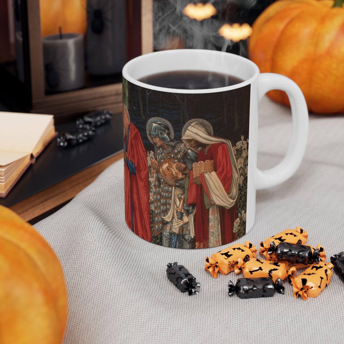 A ceramic mug with a William Morris-inspired design featuring figures in medieval attire.