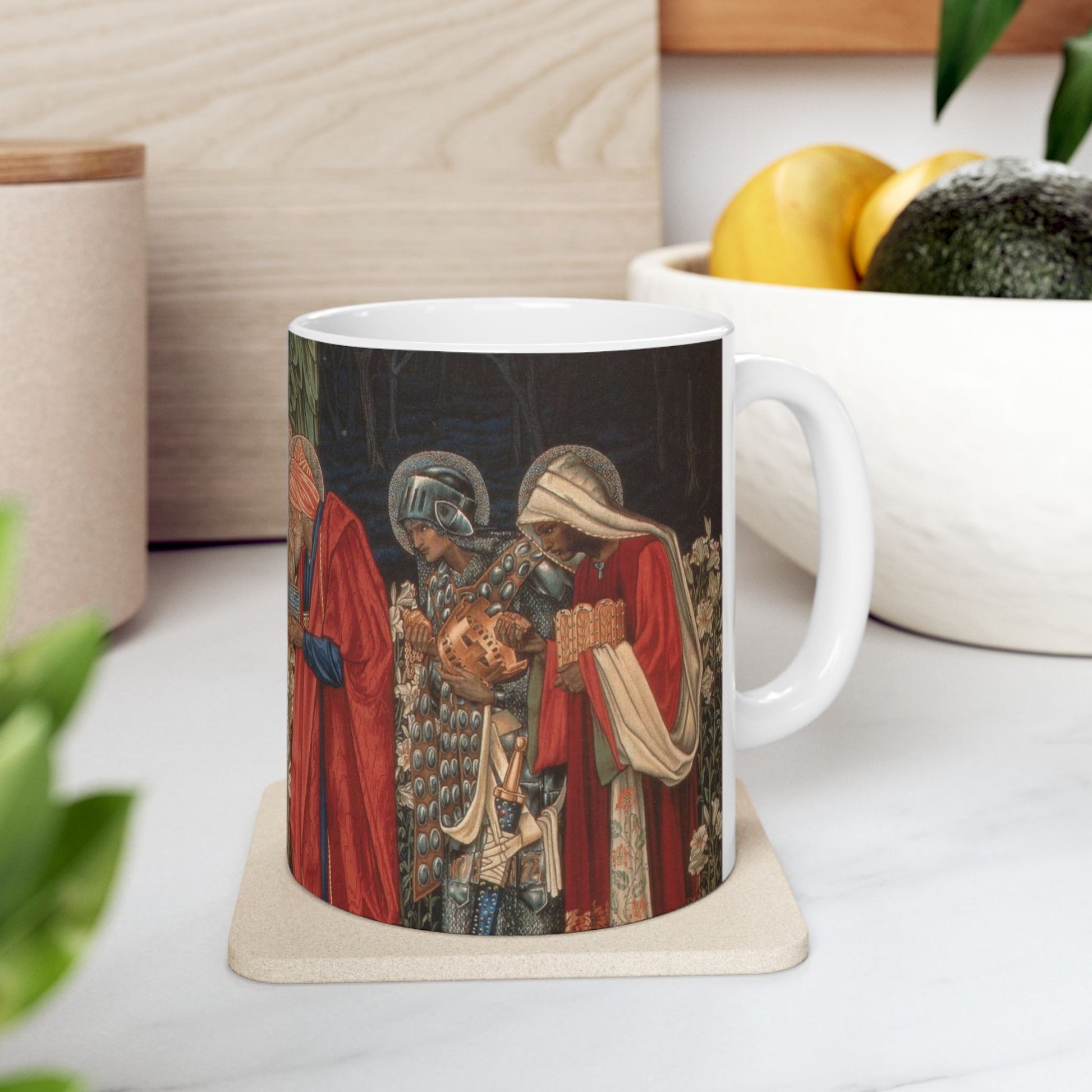 A ceramic mug with a William Morris-inspired design featuring figures in medieval attire.