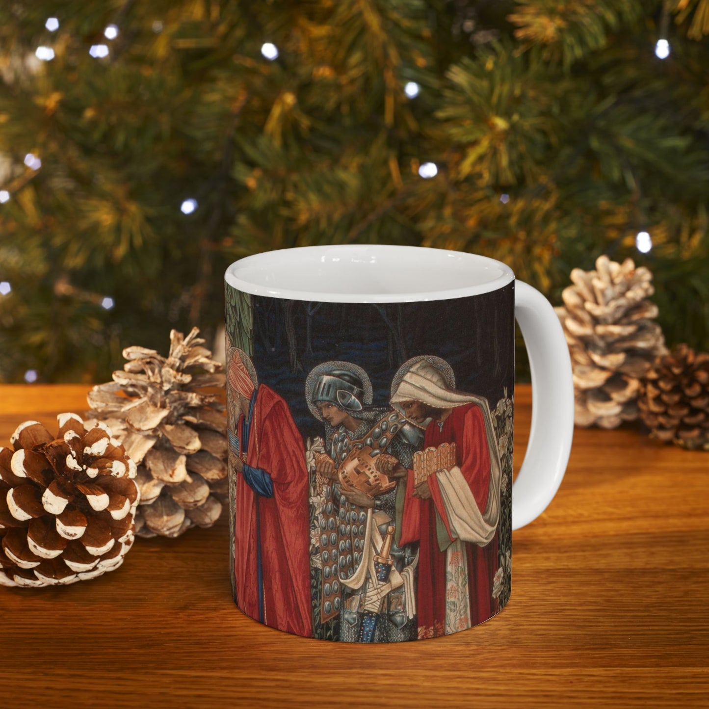 A ceramic mug with a William Morris-inspired design featuring figures in medieval attire.