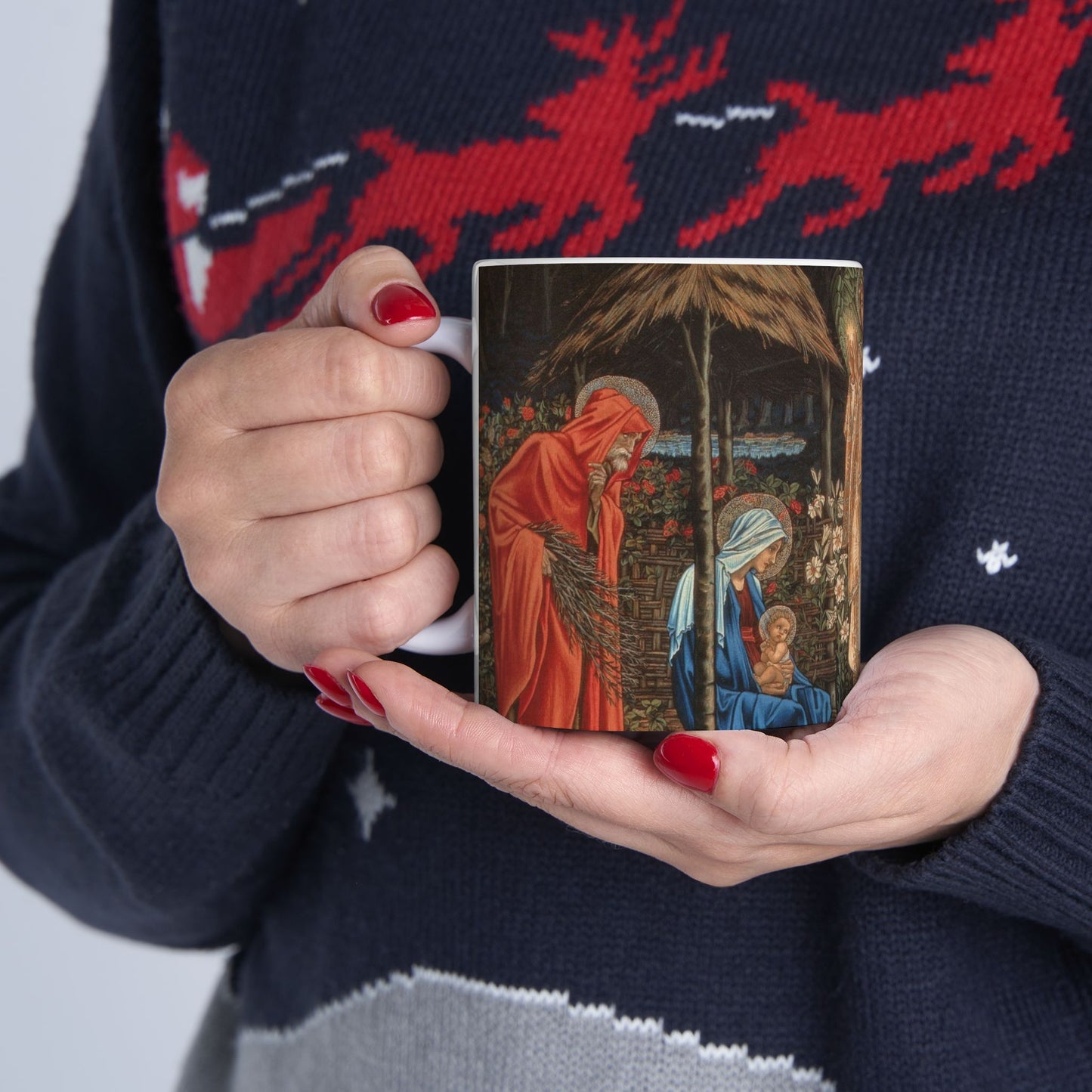A ceramic mug with a William Morris-inspired design featuring figures in medieval attire.