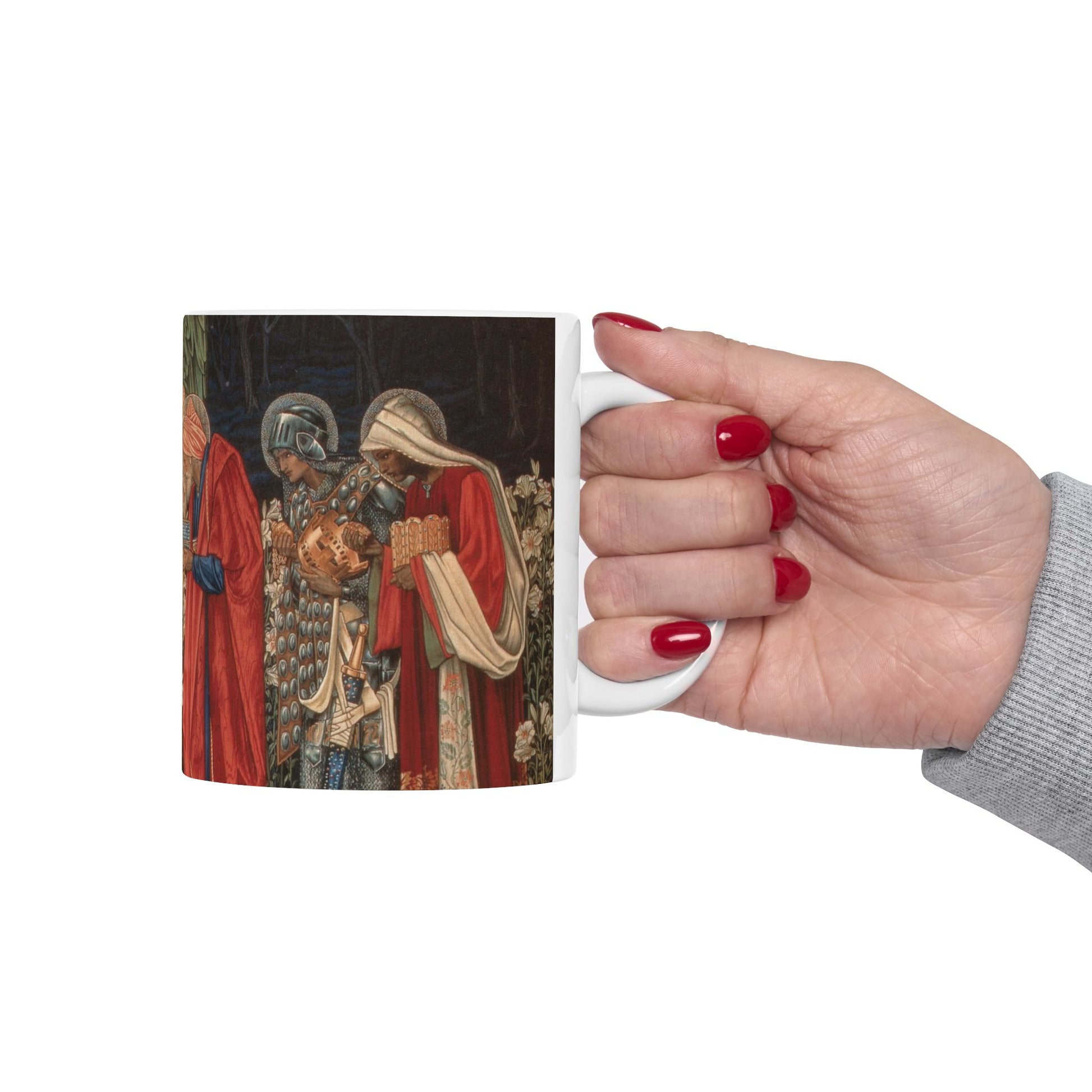 A ceramic mug with a William Morris-inspired design featuring figures in medieval attire.