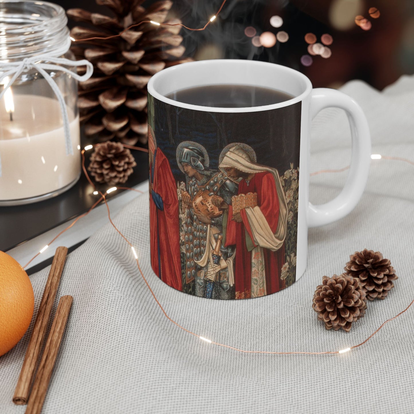 A ceramic mug with a William Morris-inspired design featuring figures in medieval attire.