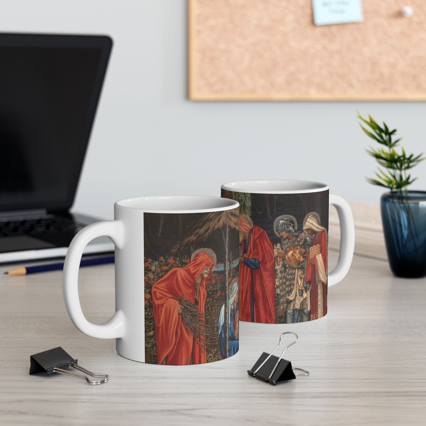 A ceramic mug with a William Morris-inspired design featuring figures in medieval attire.