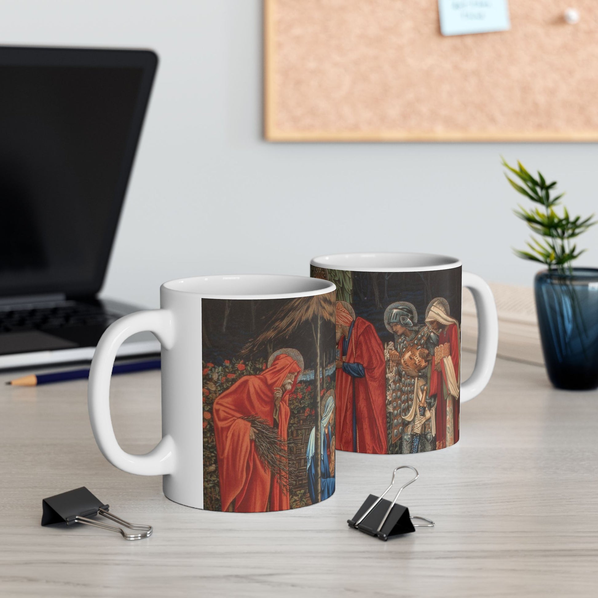 A ceramic mug with a William Morris-inspired design featuring figures in medieval attire.