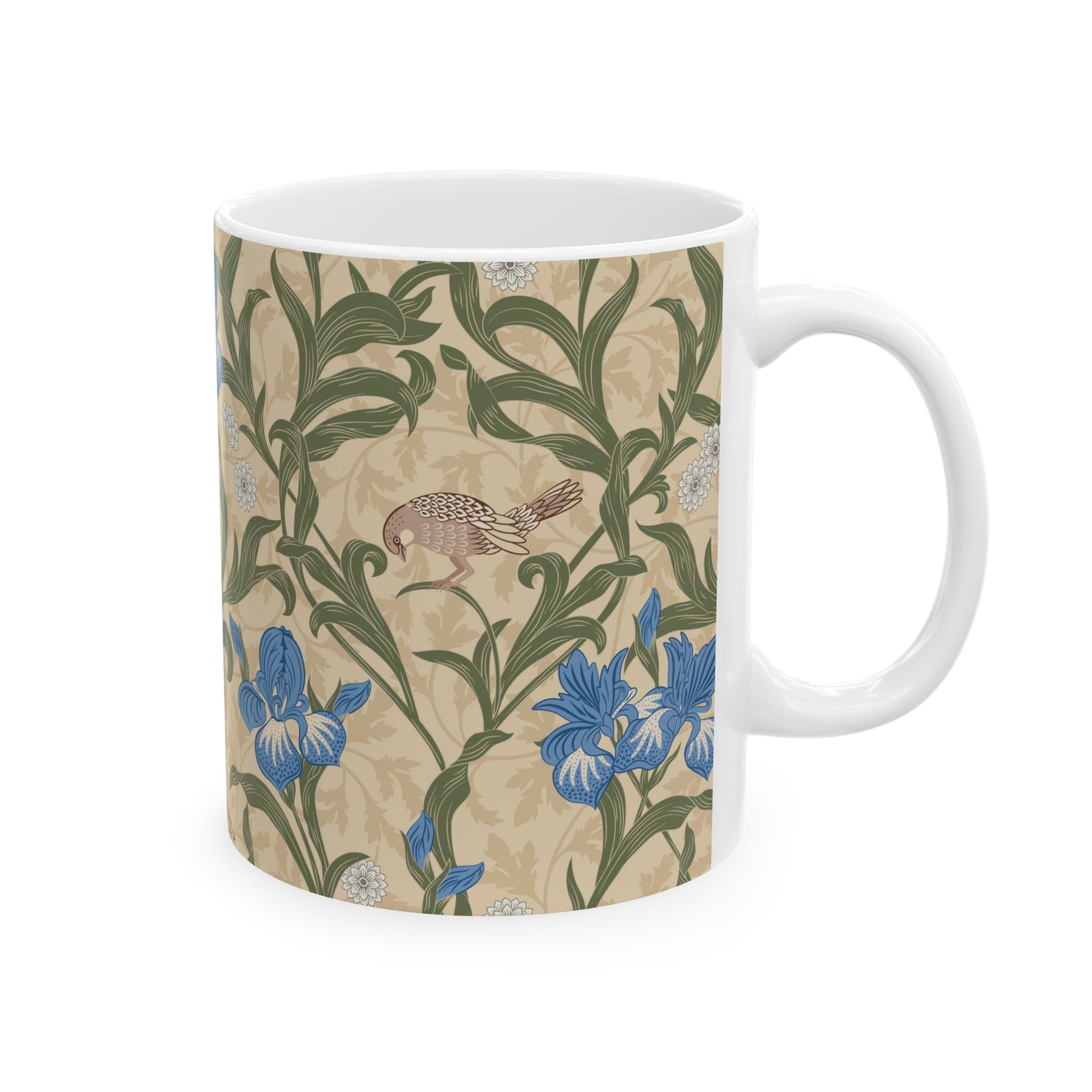 A ceramic mug with a floral William Morris & Co pattern design, featuring a bird and various flowers in shades of blue, green and beige.
