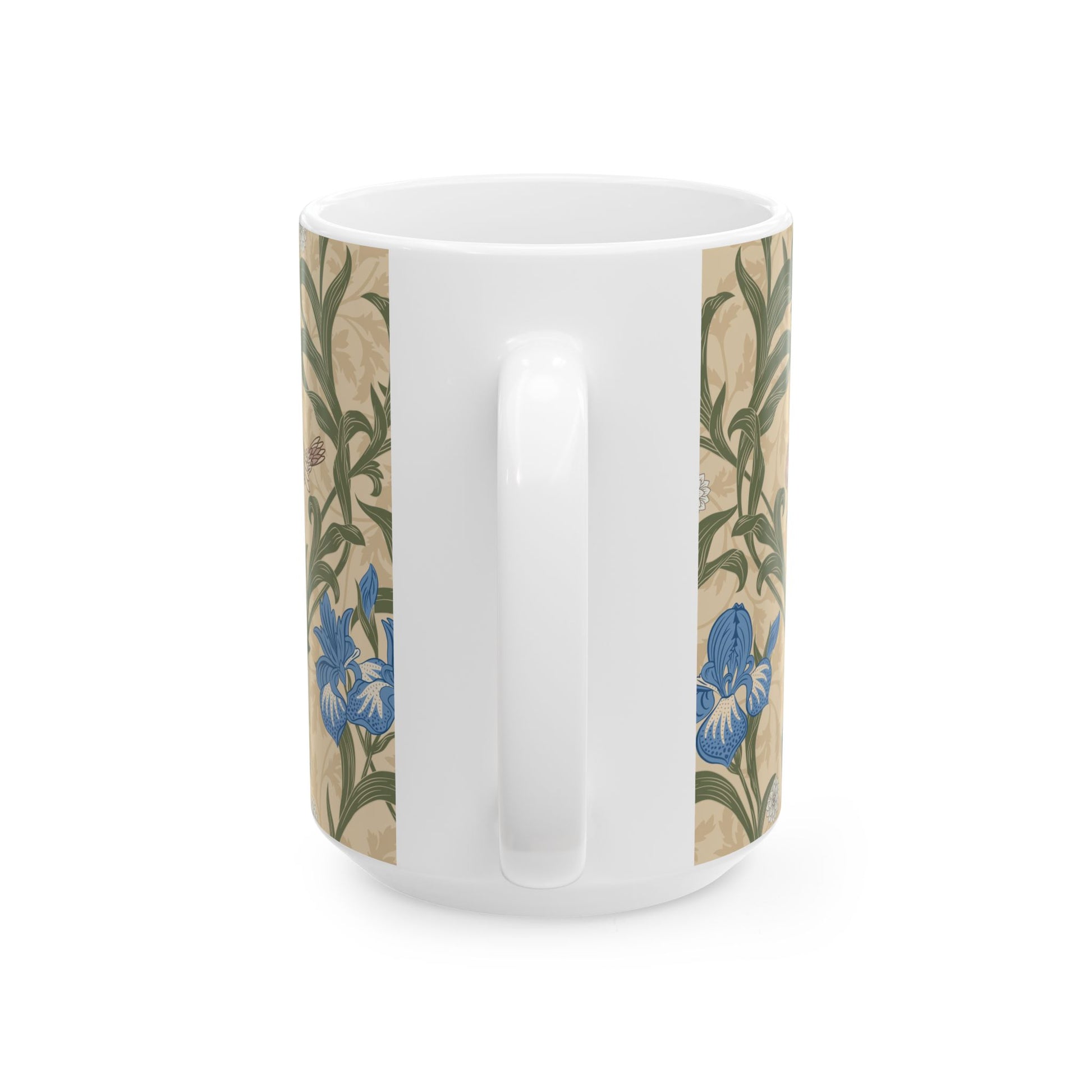 A ceramic mug with a floral William Morris & Co pattern design, featuring a bird and various flowers in shades of blue, green and beige.