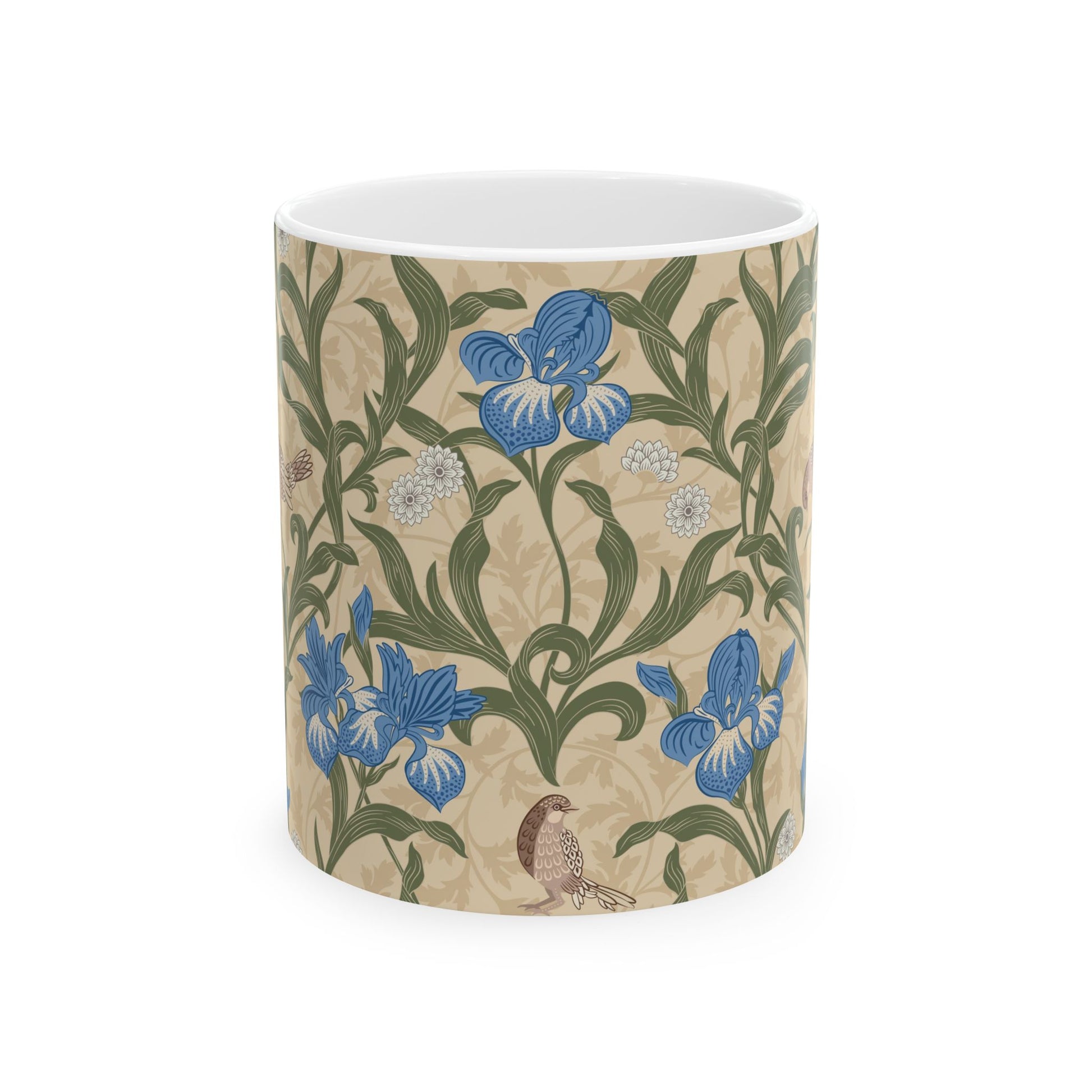 A ceramic mug with a floral William Morris & Co pattern design, featuring a bird and various flowers in shades of blue, green and beige.