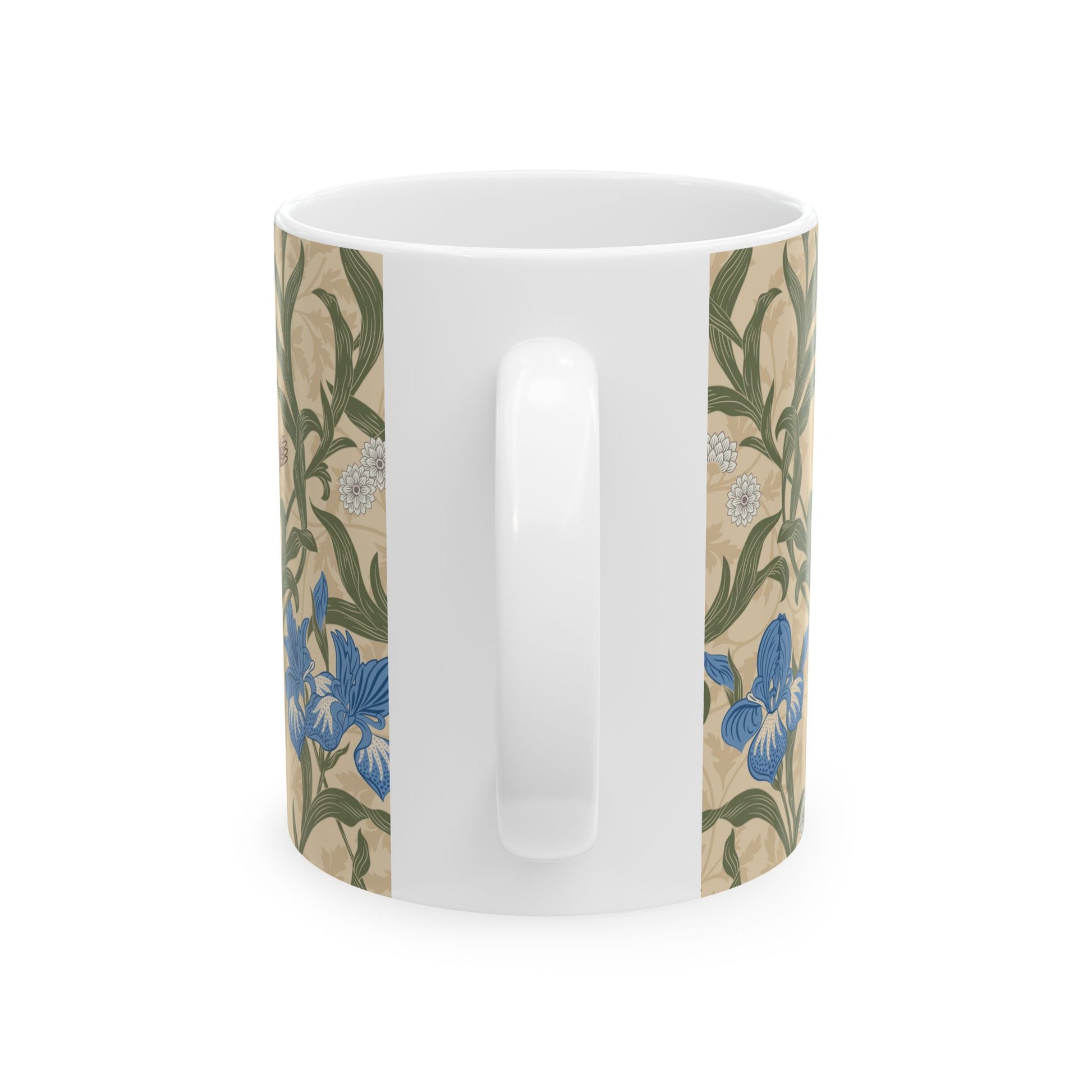 A ceramic mug with a floral William Morris & Co pattern design, featuring a bird and various flowers in shades of blue, green and beige.