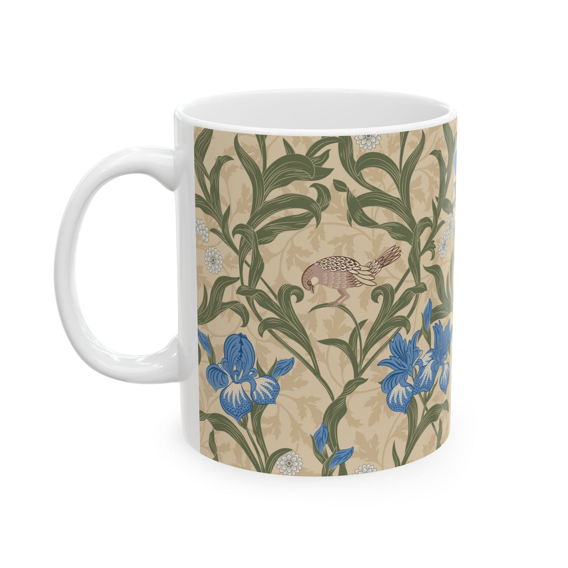 A ceramic mug with a floral William Morris & Co pattern design, featuring a bird and various flowers in shades of blue, green and beige.