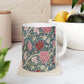 A ceramic mug with a floral pattern inspired by William Morris - Cray Collection.