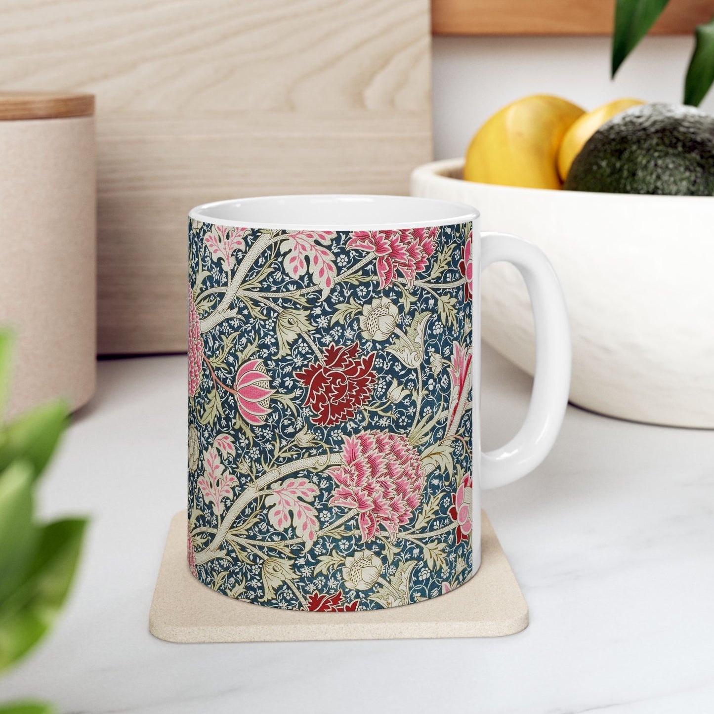 A ceramic mug with a floral pattern inspired by William Morris - Cray Collection.