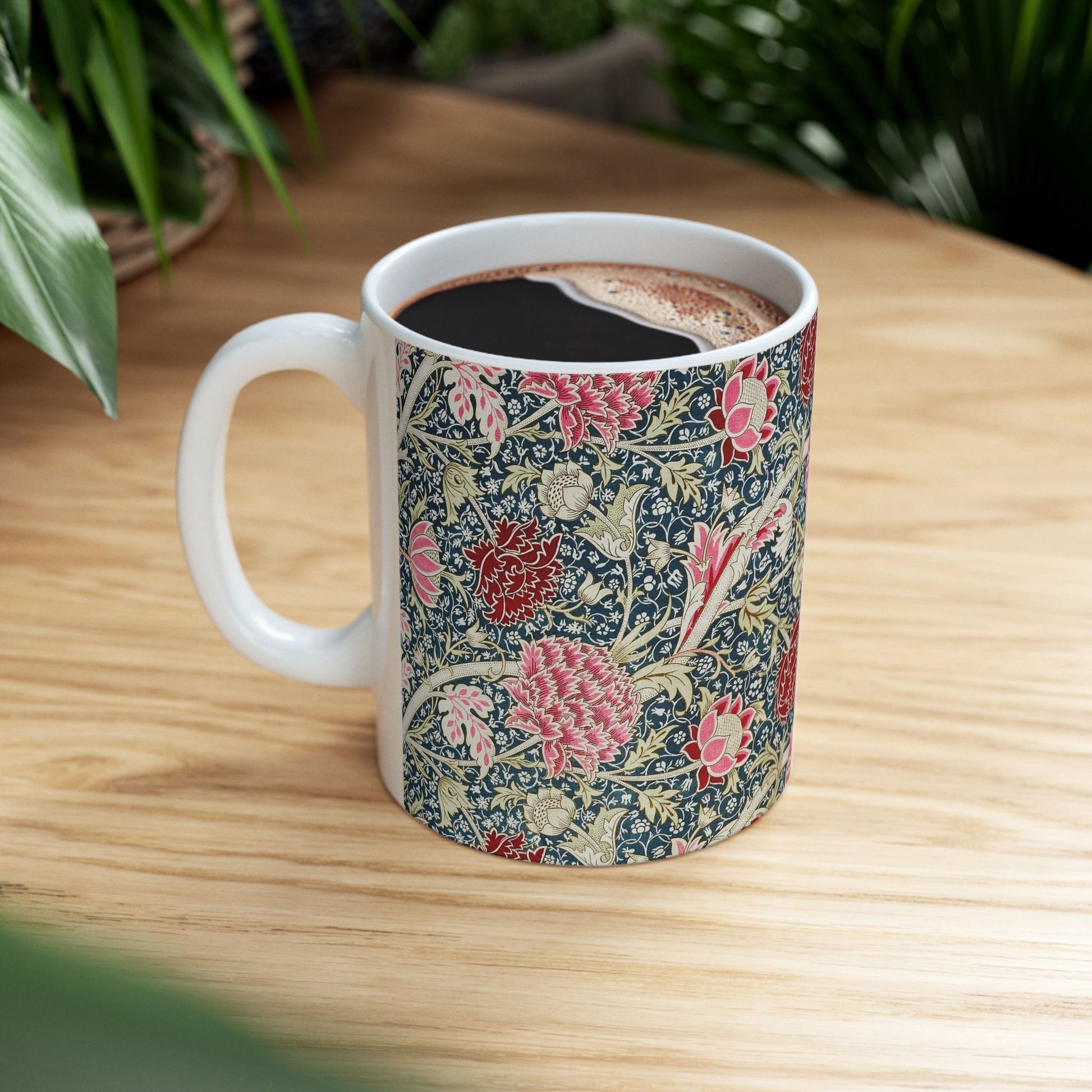 A ceramic mug with a floral pattern inspired by William Morris - Cray Collection.