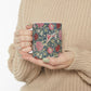 A ceramic mug with a floral pattern inspired by William Morris - Cray Collection.