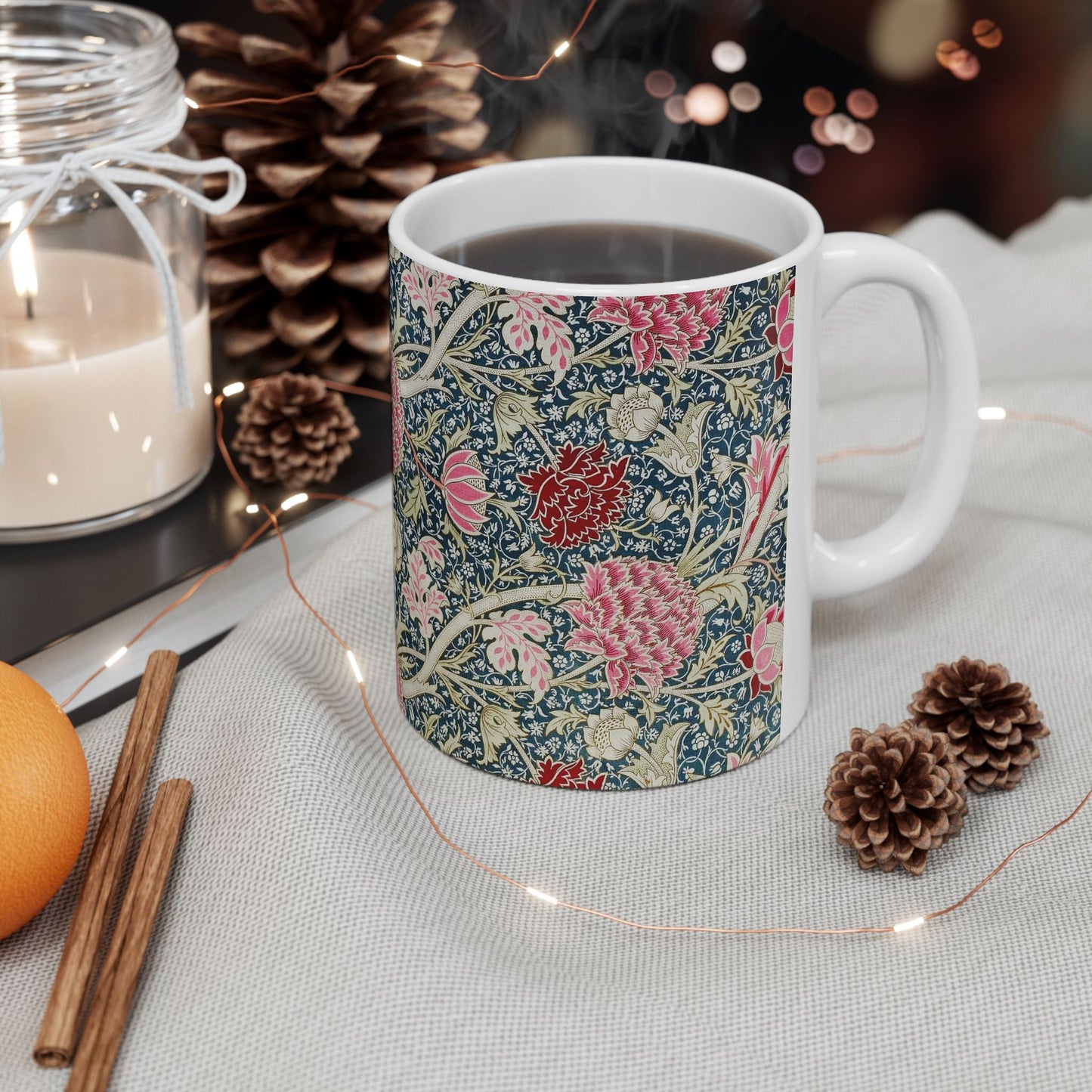 A ceramic mug with a floral pattern inspired by William Morris - Cray Collection.