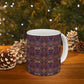 A ceramic mug with a floral pattern inspired by William Morris's artistry, featuring a white base and a shiny finish.