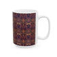 A ceramic mug with a floral pattern inspired by William Morris's artistry, featuring a white base and a shiny finish.