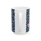 A ceramic mug with a floral pattern and a white handle featuring a blue. white, red and pink pattern design called Medway by William Morris & Co