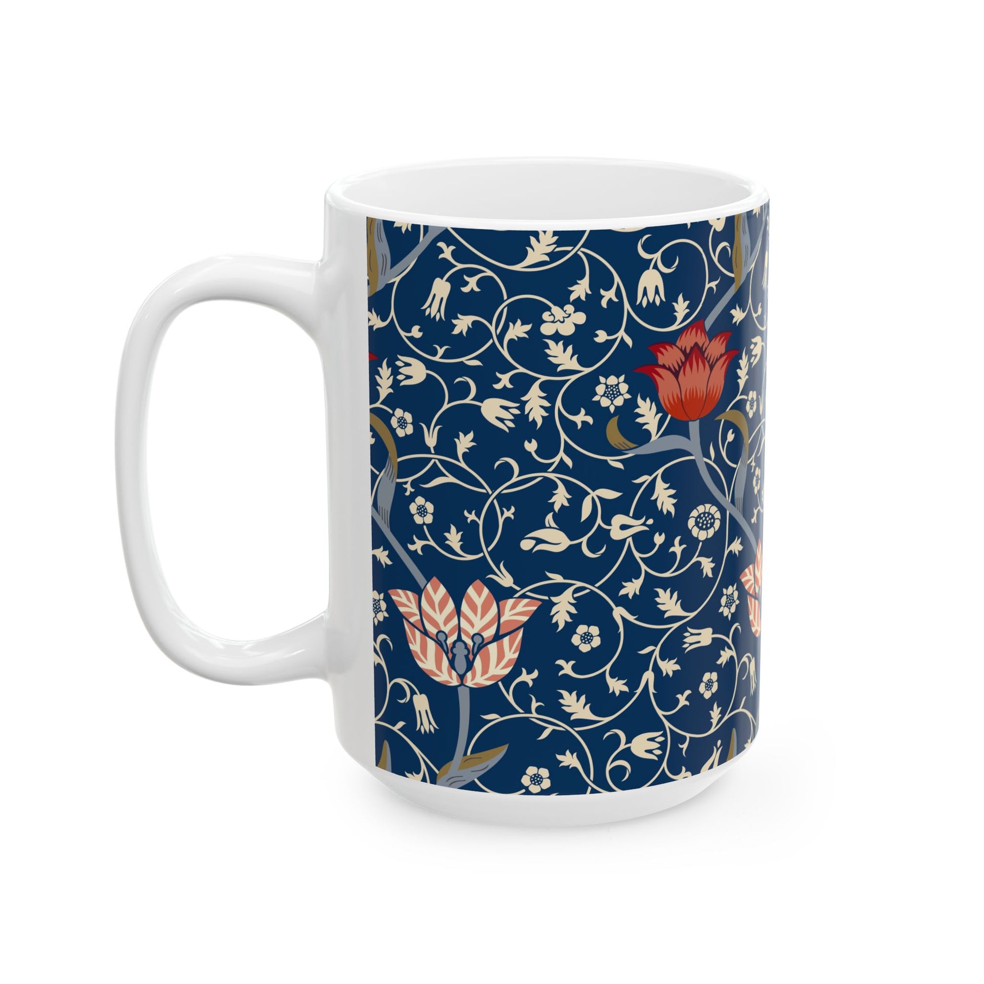 A ceramic mug with a floral pattern and a white handle featuring a blue. white, red and pink pattern design called Medway by William Morris & Co