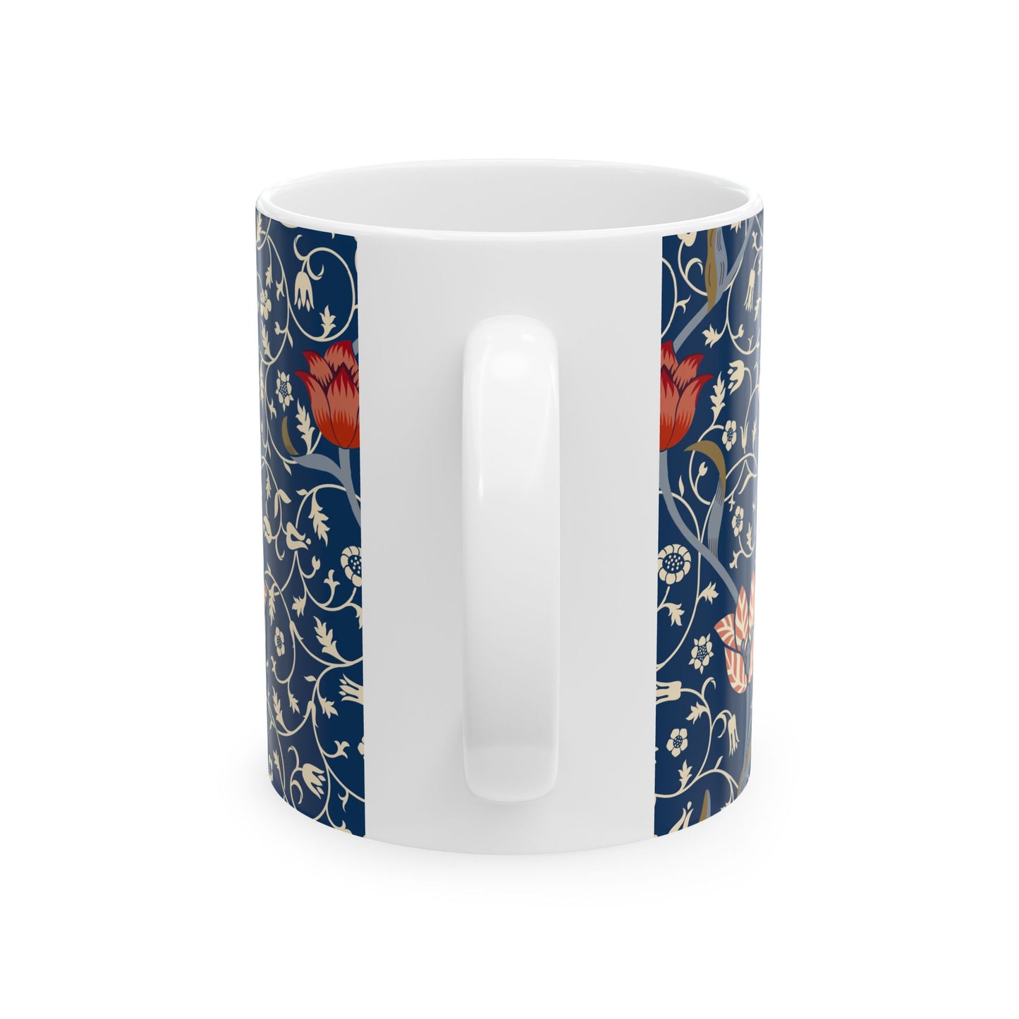 A ceramic mug with a floral pattern and a white handle featuring a blue. white, red and pink pattern design called Medway by William Morris & Co