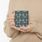 A ceramic mug with a floral pattern inspired by William Morris - Pimpernel Collection in a slate colour.
