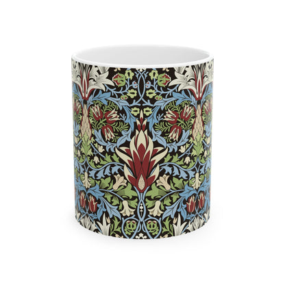 A ceramic mug with a floral and geometric pattern inspired by William Morris  & Co in a floral pattern called Snakeshead Collection.