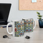 A ceramic mug with a floral and geometric pattern inspired by William Morris  & Co in a floral pattern called Snakeshead Collection.