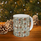 A white ceramic mug with a vintage-style floral and butterfly pattern on a wooden table, surrounded by pinecones and a blurred Christmas tree background with lights.