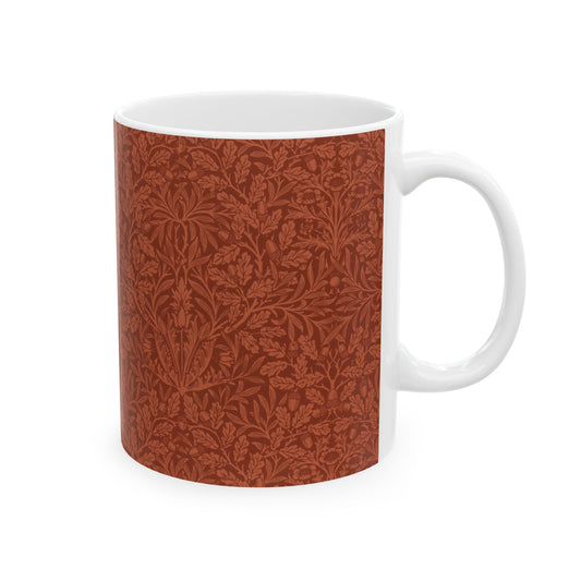 A ceramic mug with a rust-coloured floral pattern inspired by William Morris - Acorns & Oak Leaves Collection.