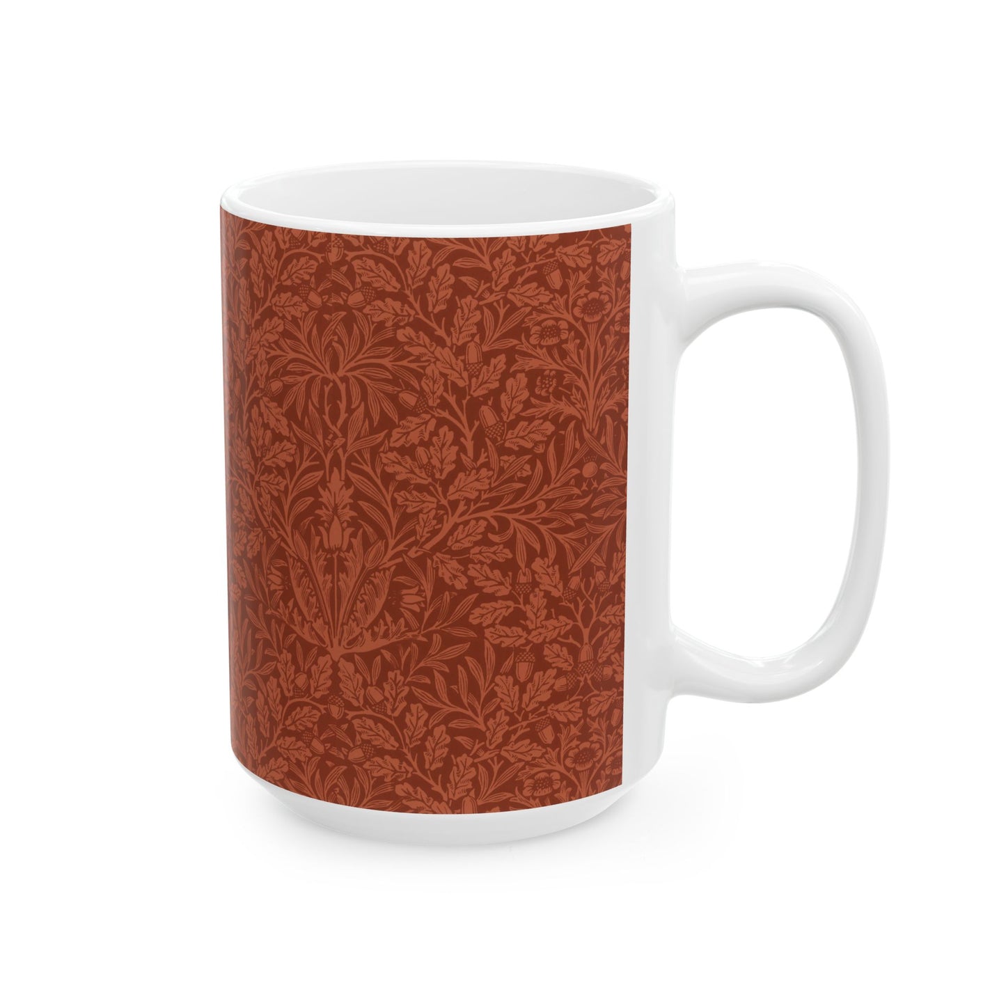 A ceramic mug with a rust-coloured floral pattern inspired by William Morris - Acorns & Oak Leaves Collection.