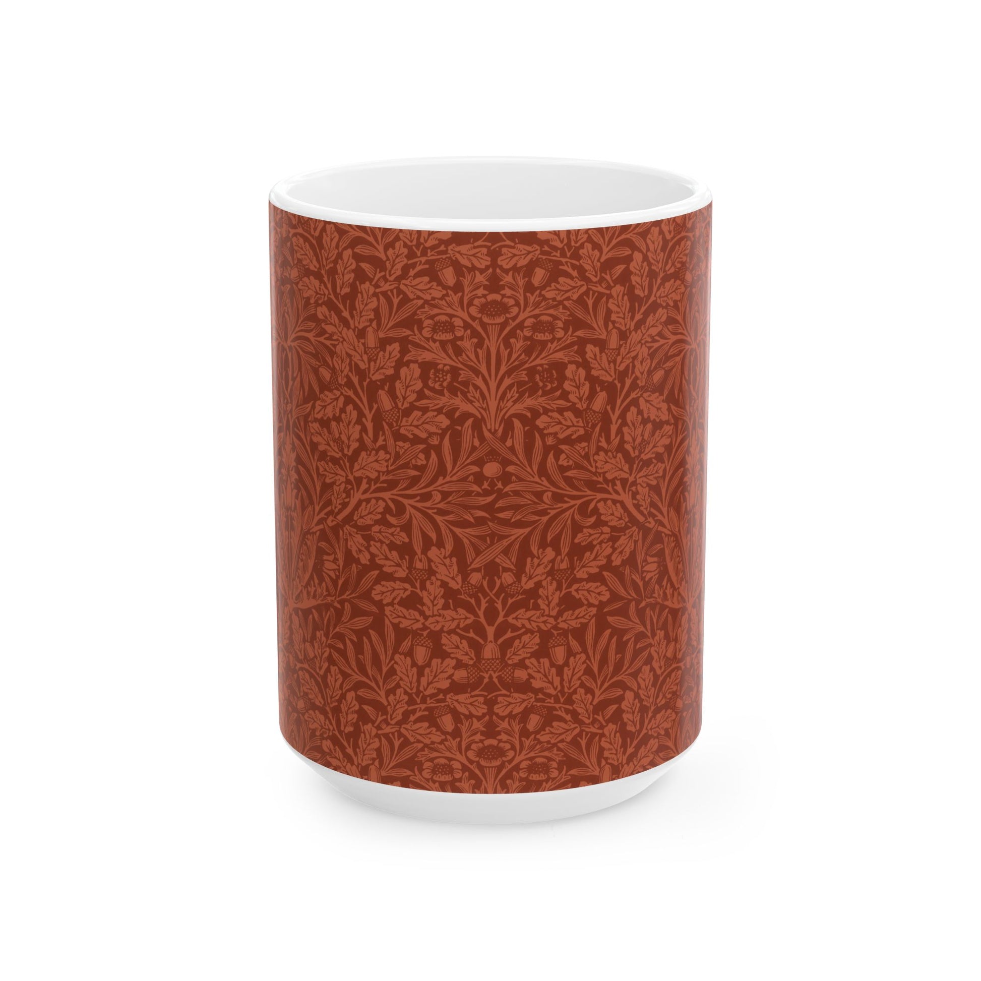 A ceramic mug with a rust-coloured floral pattern inspired by William Morris - Acorns & Oak Leaves Collection.