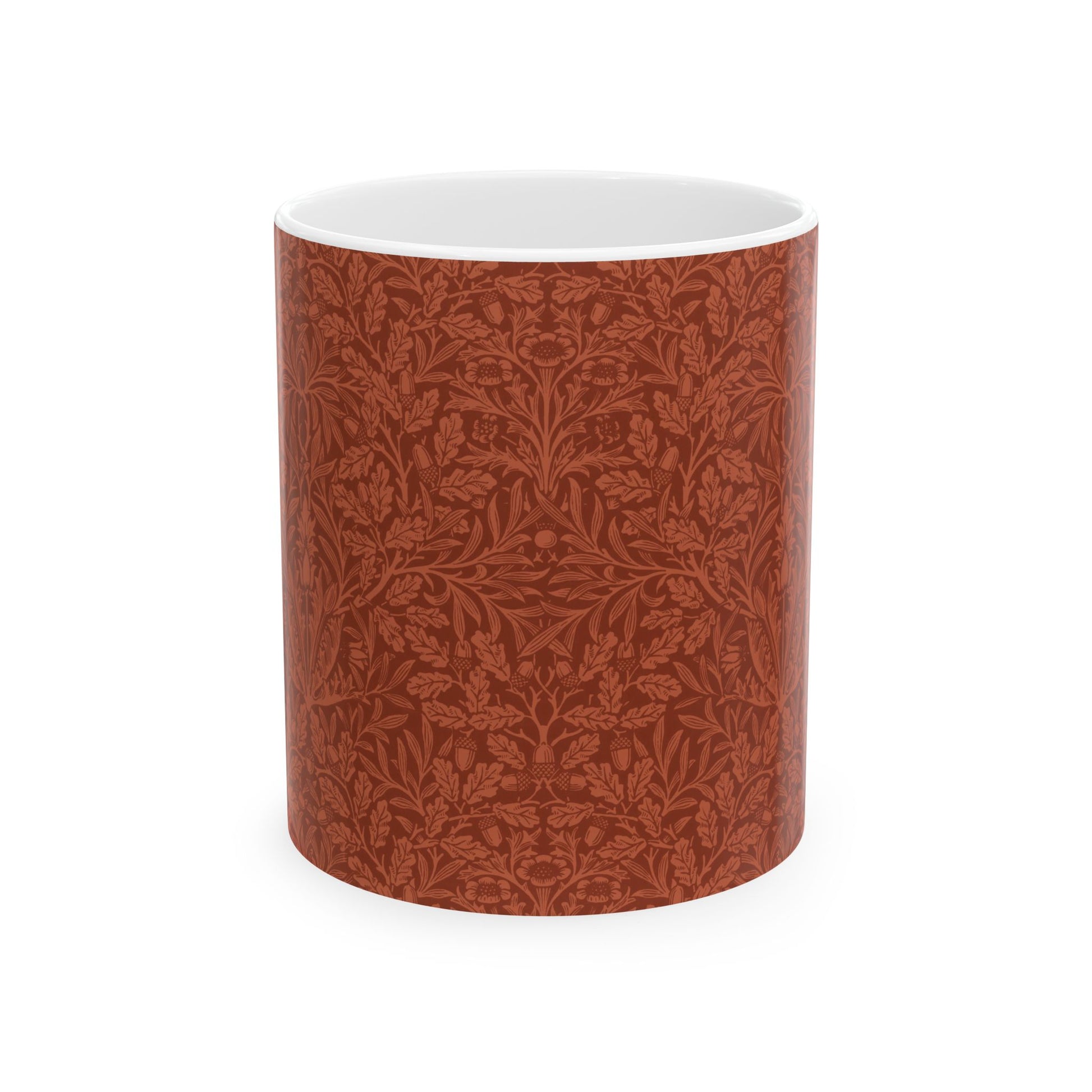 A ceramic mug with a rust-coloured floral pattern inspired by William Morris - Acorns & Oak Leaves Collection.