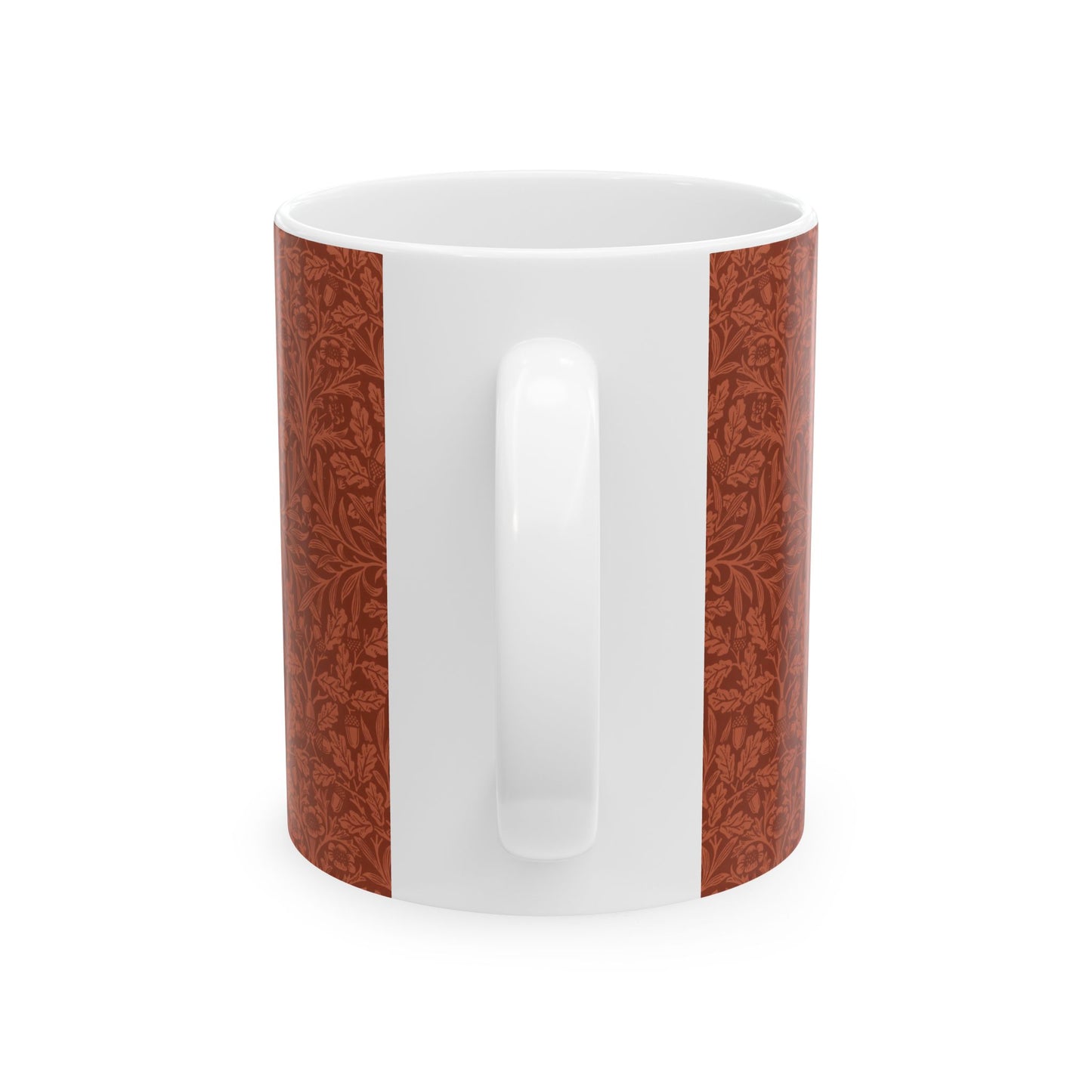 A ceramic mug with a rust-coloured floral pattern inspired by William Morris - Acorns & Oak Leaves Collection.
